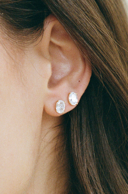 Porter Oval Studs product shot showing the oval-cut cubic zirconia stone and prong setting in close detail