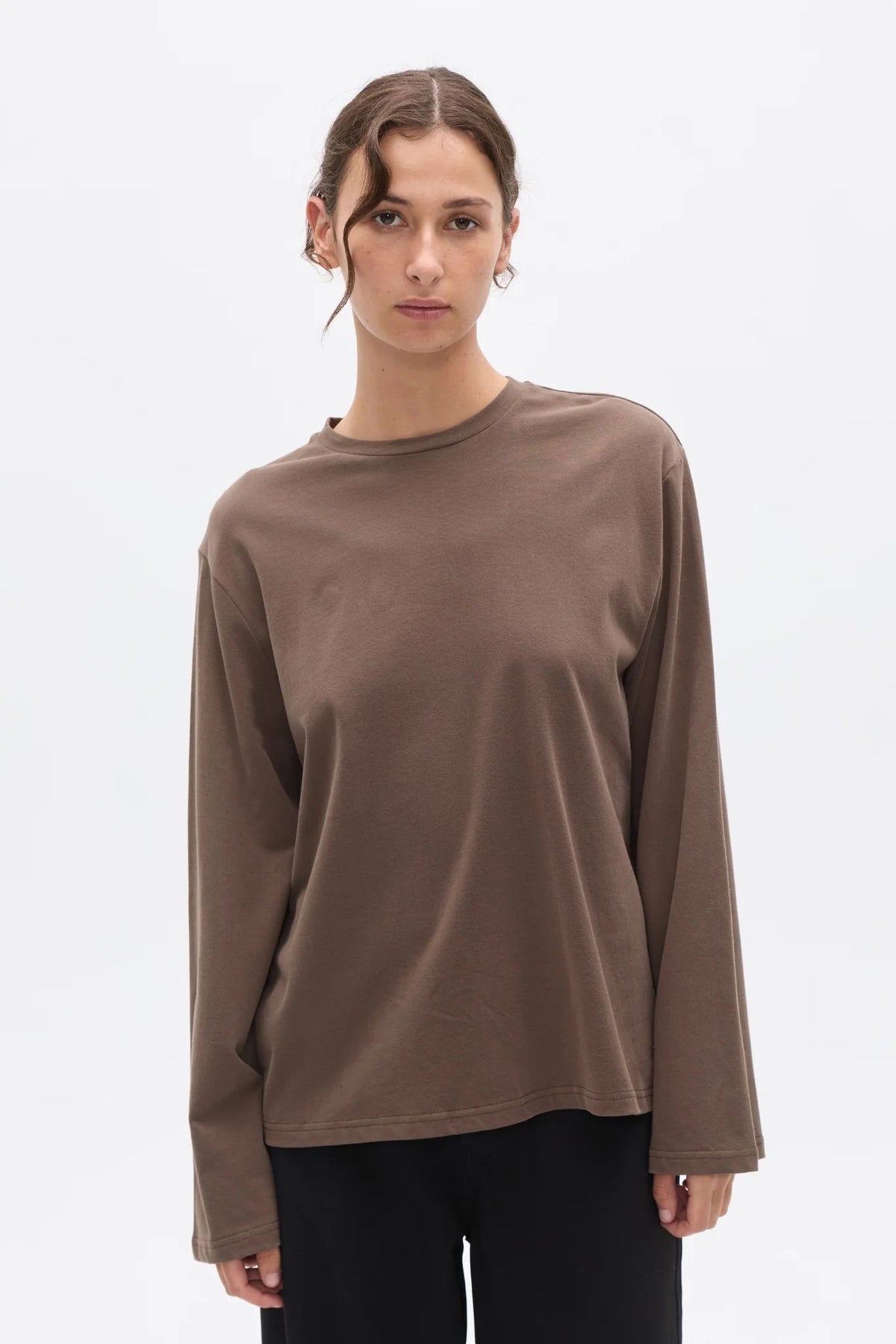 Bayse Brand Priya Long Sleeve Top in Brown — a refined everyday essential with an effortless, modern shape, the Bayse Brand Priya Long Sleeve in Brown features a relaxed fit, dropped shoulders and elongated sleeves.