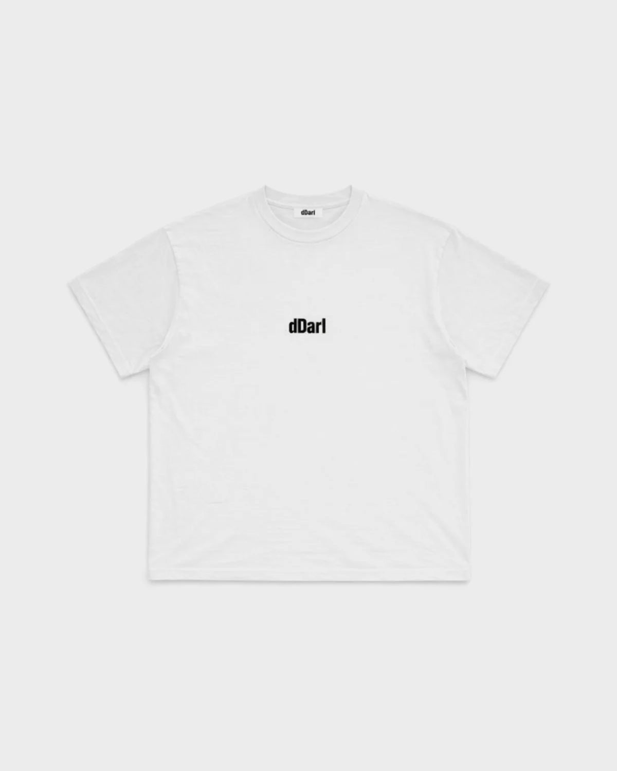 dDARL Puff Tee in White, front flat lay with black puff logo