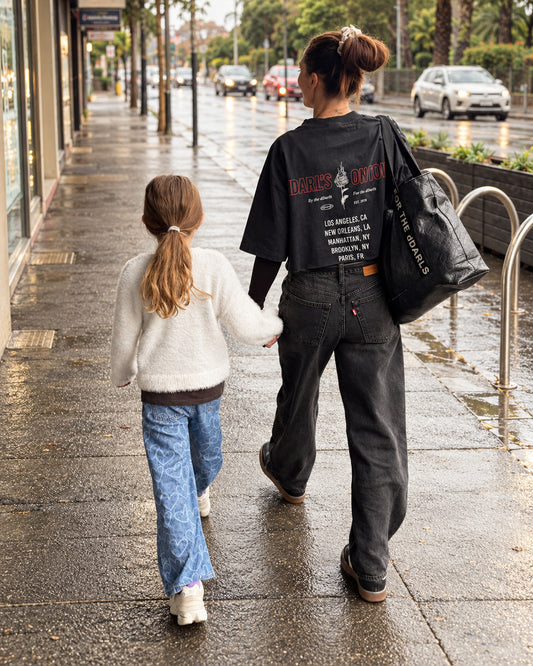 dDARL Tour SS Tee in Black, lifestyle photo worn on the street