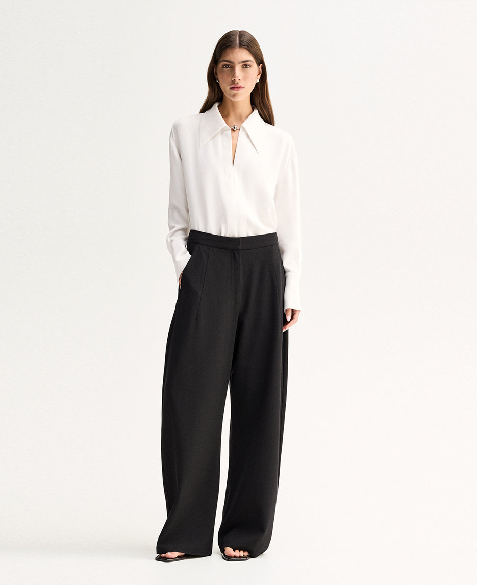 Elka Collective Millicent Shirt in Ivory — meet the shirt that trades basic for statement.