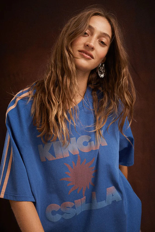 Kinga Csilla Sunset Tee in Blue — the Sunset Tee returns to inject some serious dopamine into your everyday wardrobe.
