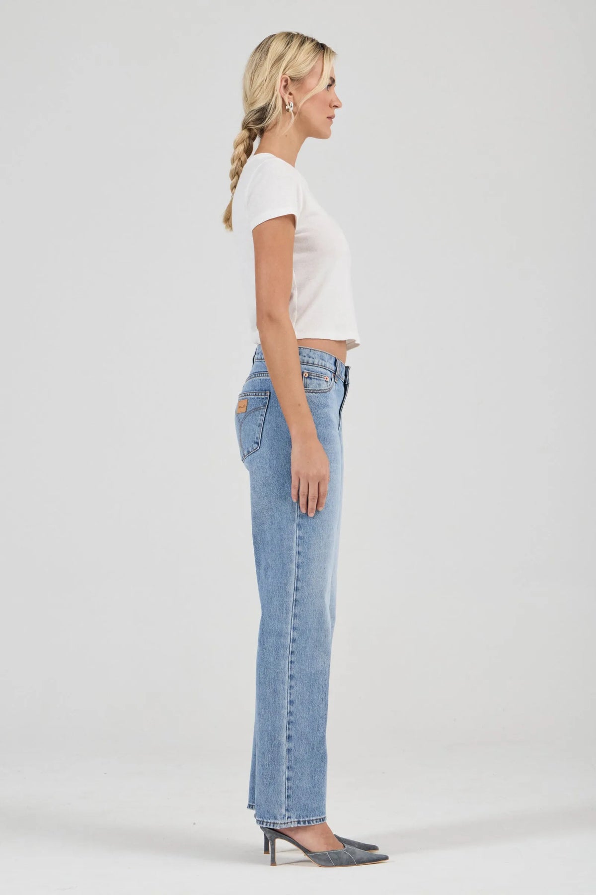 Rolla’s Classic Tee in Vintage White, full-length side view on model.