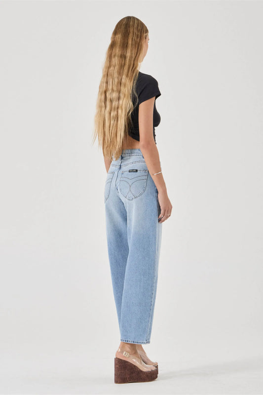 Rollas Gigi Barrel Jeans Brad in Blue — the Gigi Barrel Jean in Brad Blue by Rolla's is a super high-rise style designed to hold through the seat, creating a flattering, structured fit.