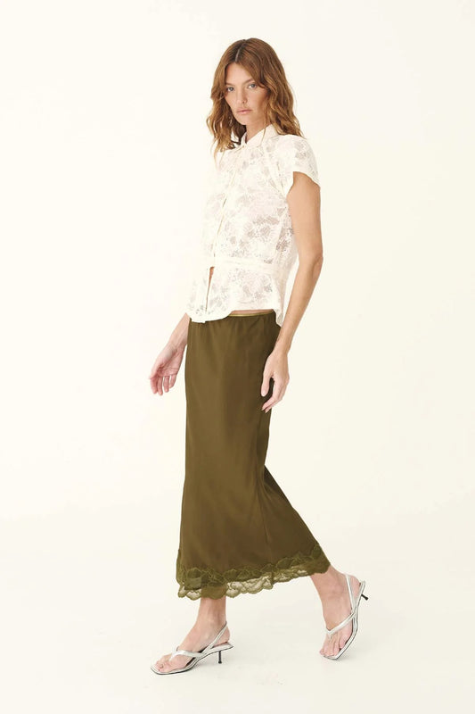 Rowie Marina Silk Midi Skirt in Olive — a refined wardrobe piece with an effortlessly fluid silhouette, the Rowie The Label Marina Midi Skirt in Olive is cut on the bias to softly skim the body.