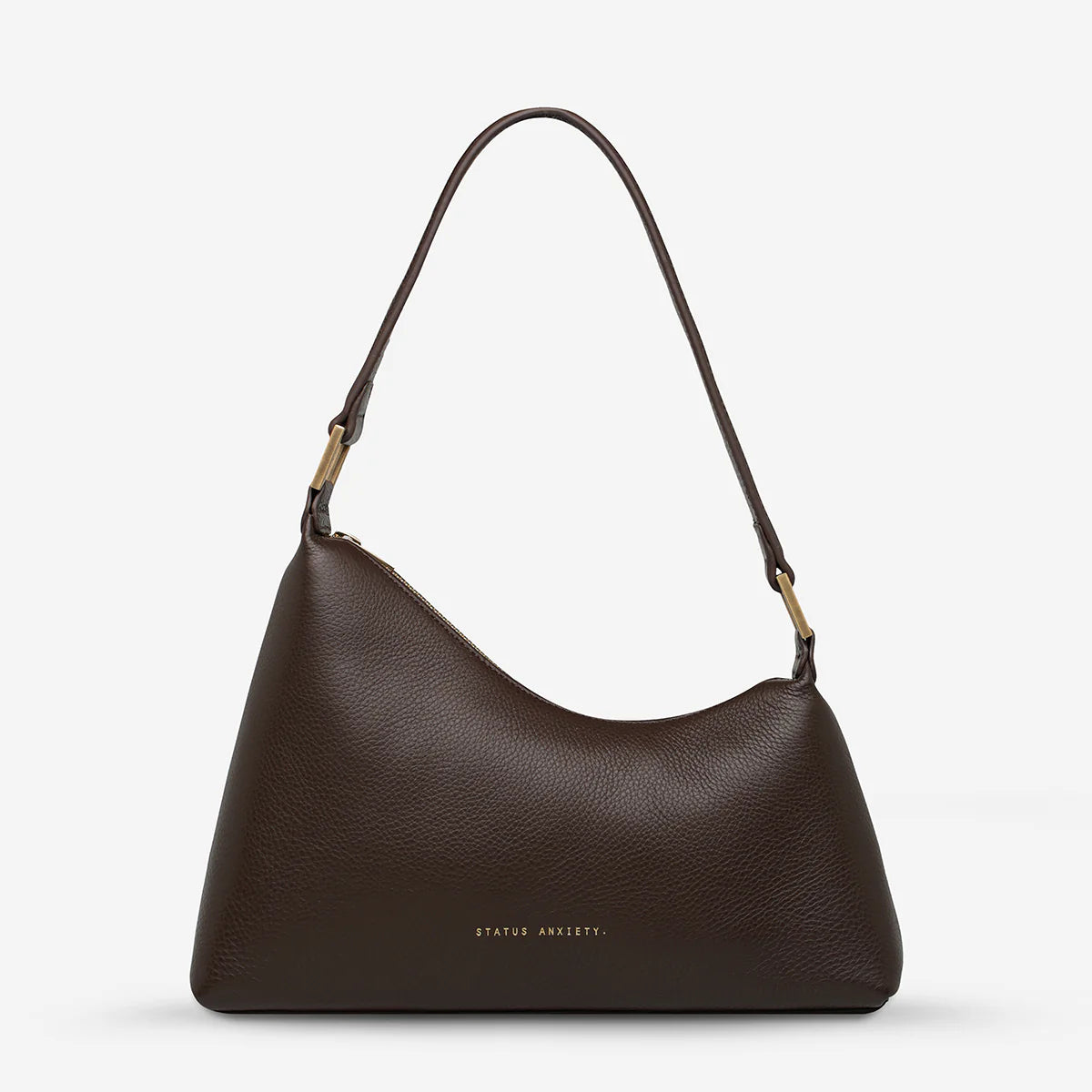 Status Anxiety Reverie Bag Cocoa — the Reverie Bag in Cocoa with brushed gold hardware by Status Anxiety is an easy statement piece with a clean, sculptural shape.