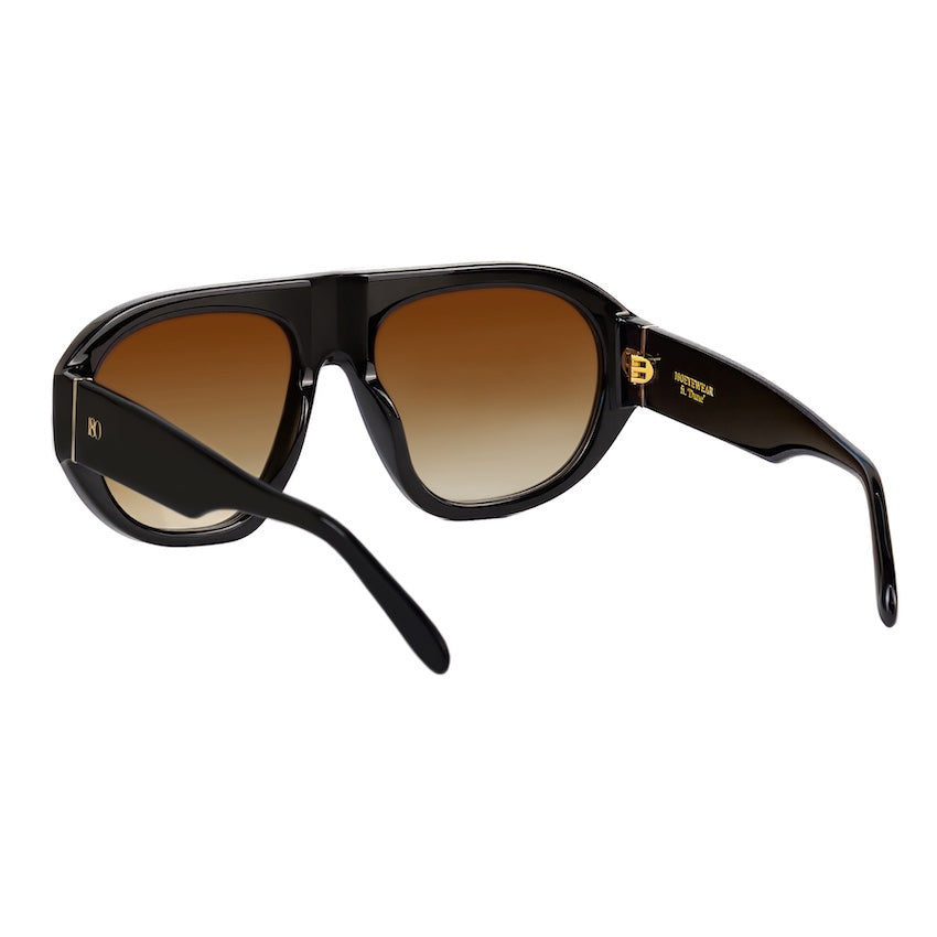 Three-quarter view of black sunglasses with brown gradient lenses and extended temples.