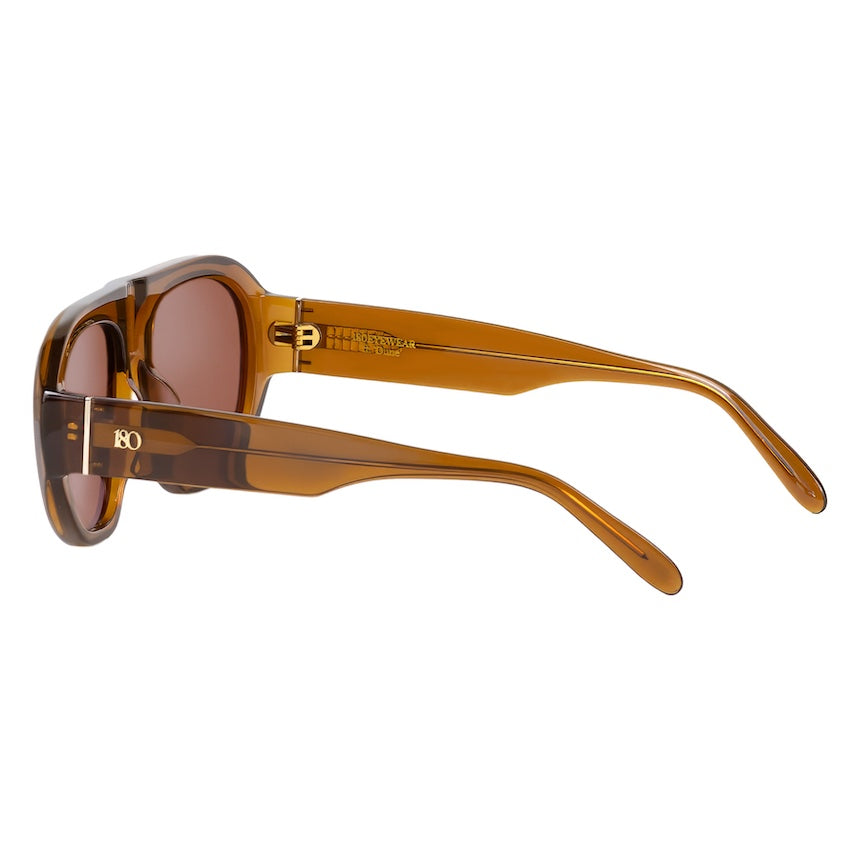 Side view of the Whiskey sunglasses showing the curved frame, brown lenses and slim temples.