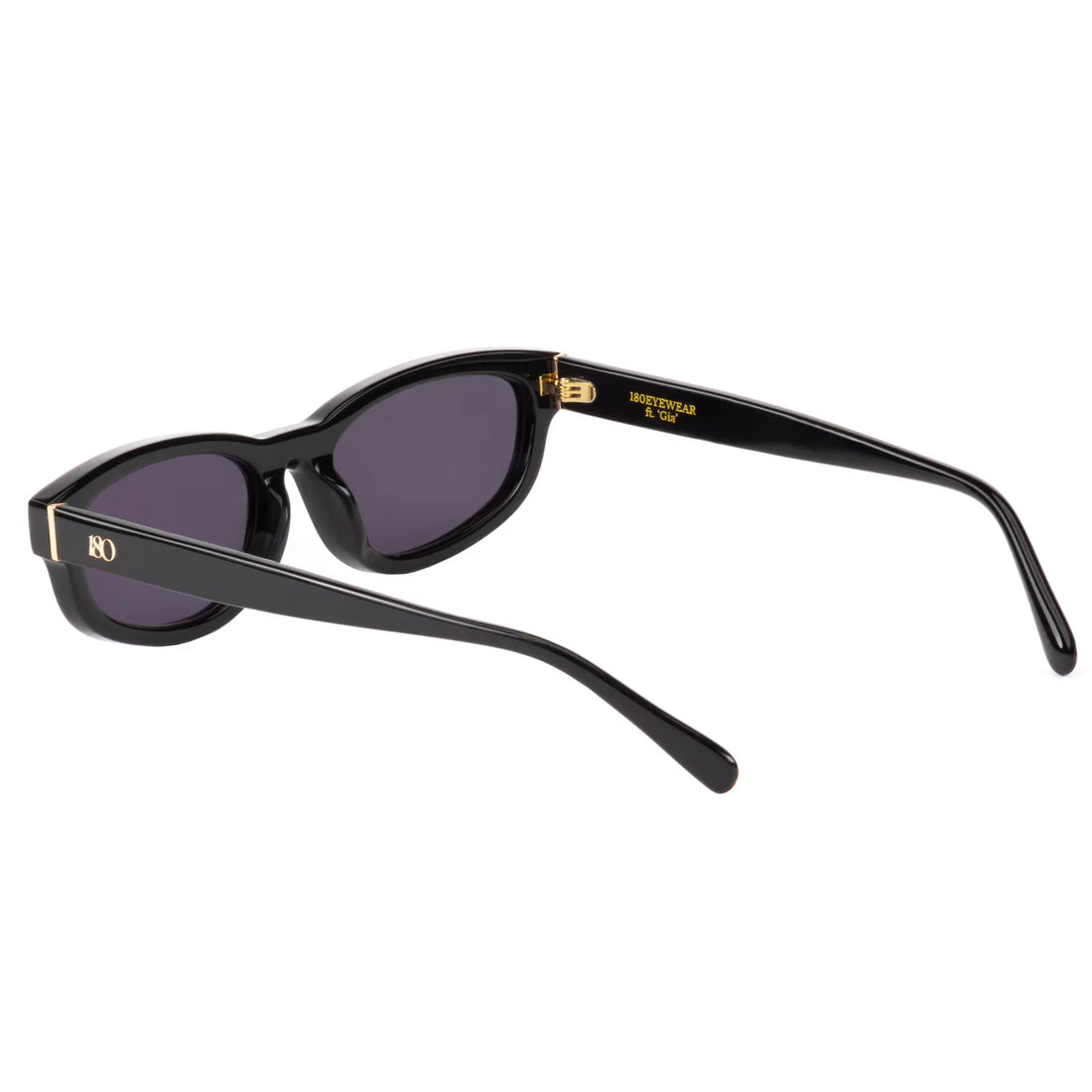 Interior angled view of the 180EYEWEAR 'Gia' sunglasses in gloss black, showing the gold '180EYEWEAR' branding on the inside of the temple arm and the hinge detail.