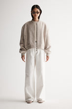 Elka Collective’s Nonnie Jacket is a cropped wool-blend bomber with an oversized fit, ribbed trim, and double zip—perfect for laid-back styling.