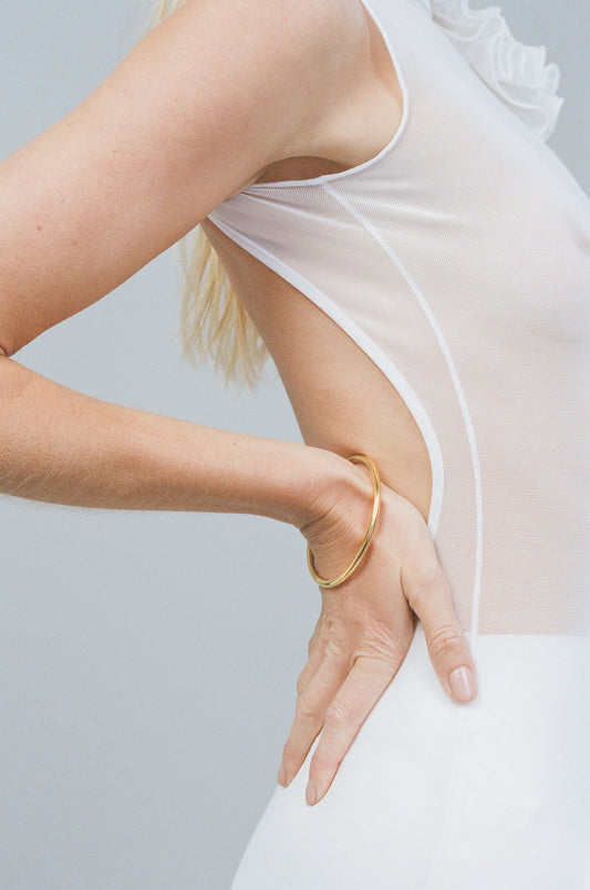 Porter Tube Bangle 6mm in Gold, product shot showing the sleek tubular band