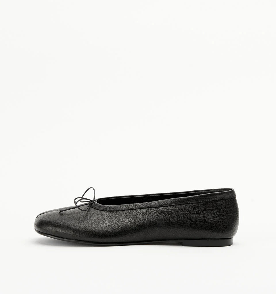 Alias Mae Lana Tabi Ballet Flat in Black Tumble, side profile showing the low heel and leather finish.
