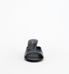 Front view of the black open-toe mule showing the wide crinkle leather strap and rounded toe shape.