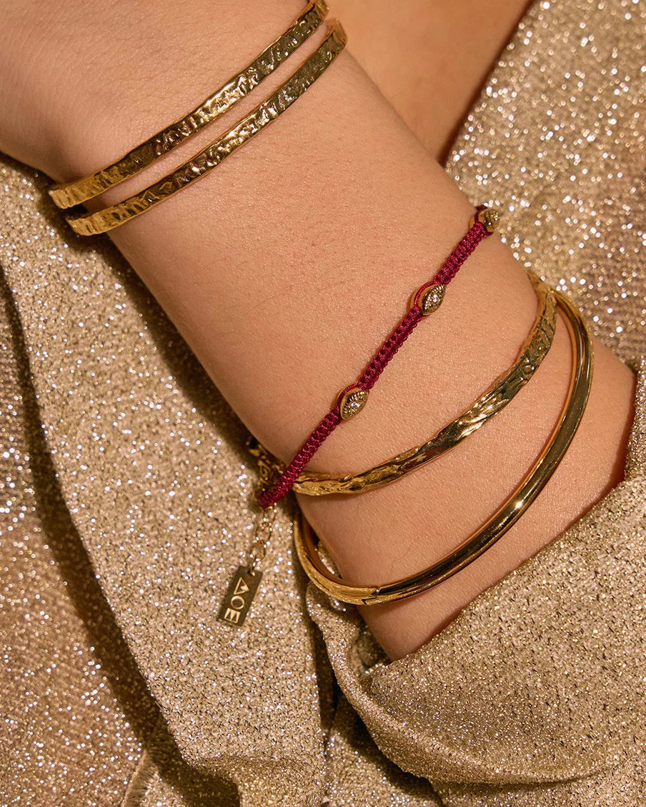 Arms of Eve Eye Bracelet in Burgundy — the protective, symbolic addition your daily jewelry stack has been waiting for.