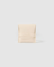 Open cream Arms Of Eve ring box displayed on a light grey background, showing the padded jewellery holder inside.
