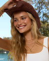 Arms of Eve Jackson Sunhat — channel laid-back cowboy style with the Arms of Eve Jackson Sunhat, this season's must-have woven beauty.