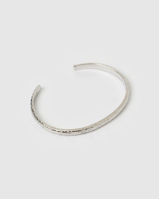 Silver bracelet on a light gray background