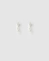 Pair of silver hoop earrings on a light gray background