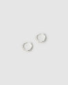 Two silver hoop earrings on a light gray background