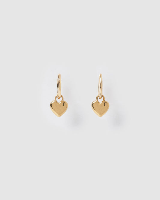 Arms Of Eve Treasure Gold Earrings with polished heart charms on a light background.