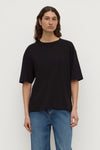 A Cotton Hemp Tee in black shown from the front with a relaxed boxy fit and short sleeves.