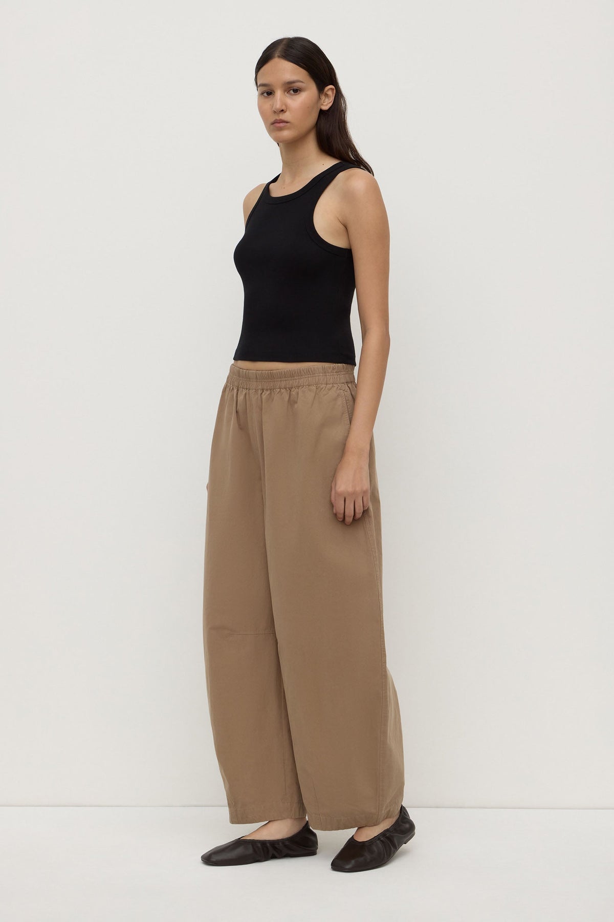 Assembly Label Lola Barrel Pant in Dark Tan, angled side view on model.

