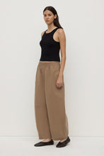 Assembly Label Lola Barrel Pant in Dark Tan, angled side view on model.

