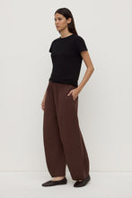 Assembly Label Lola Barrel Pant in Ganache, angled side view on model with hand in pocket.
