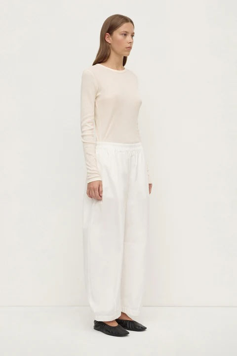 Assembly Label Lola Barrel Pants in White — a modern wardrobe staple with a softly sculpted silhouette, the Assembly Label Lola Barrel Pants in White feature a relaxed curved leg with subtle tapering through the hem.