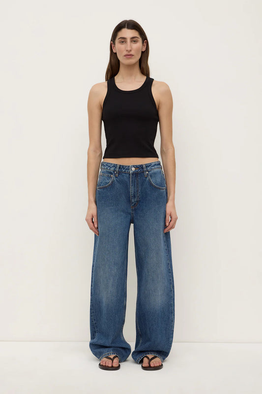 Assembly Label Low Curve Jeans in Mid Blue — the Assembly Label Low Curve Jeans in Mid Blue offer a relaxed take on everyday denim with a contemporary curved-leg silhouette.