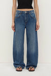 Assembly Label Low Curve Jeans in Mid Blue — the Assembly Label Low Curve Jeans in Mid Blue offer a relaxed take on everyday denim with a contemporary curved-leg silhouette.