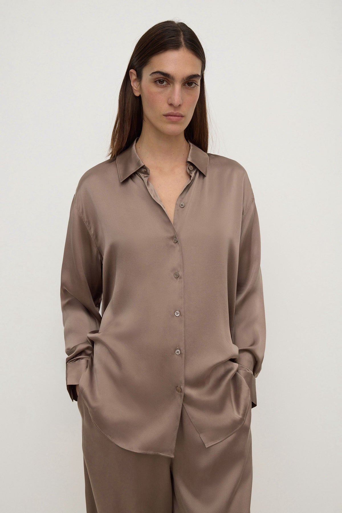 Assembly Label Pippa Silk Long Sleeve Shirt in Dark Sand — consider this your new quiet-luxury uniform piece.