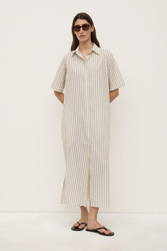 Model wearing the striped midi shirt dress with sunglasses and black sandals, showing the relaxed fit, button-through front and straight midi-length hem, full-length front view
