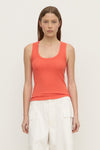 A model wears a dahlia rib tank with a scoop neckline and fitted silhouette in a front view.