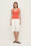 A model wears the dahlia rib tank with white cargo shorts in a full front view.