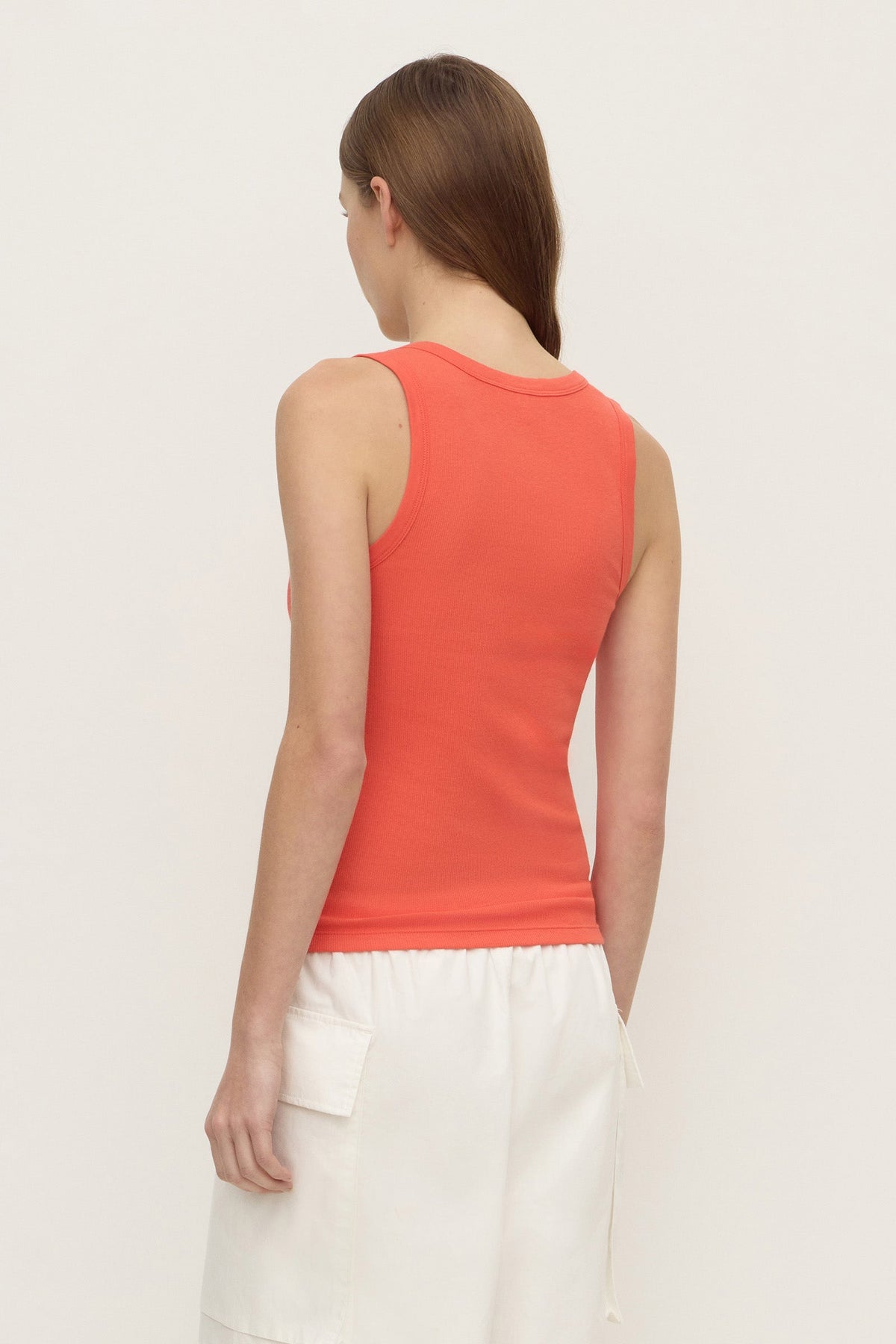 Back view of a model wearing the dahlia rib tank, showing the wide shoulder straps and fitted silhouette.