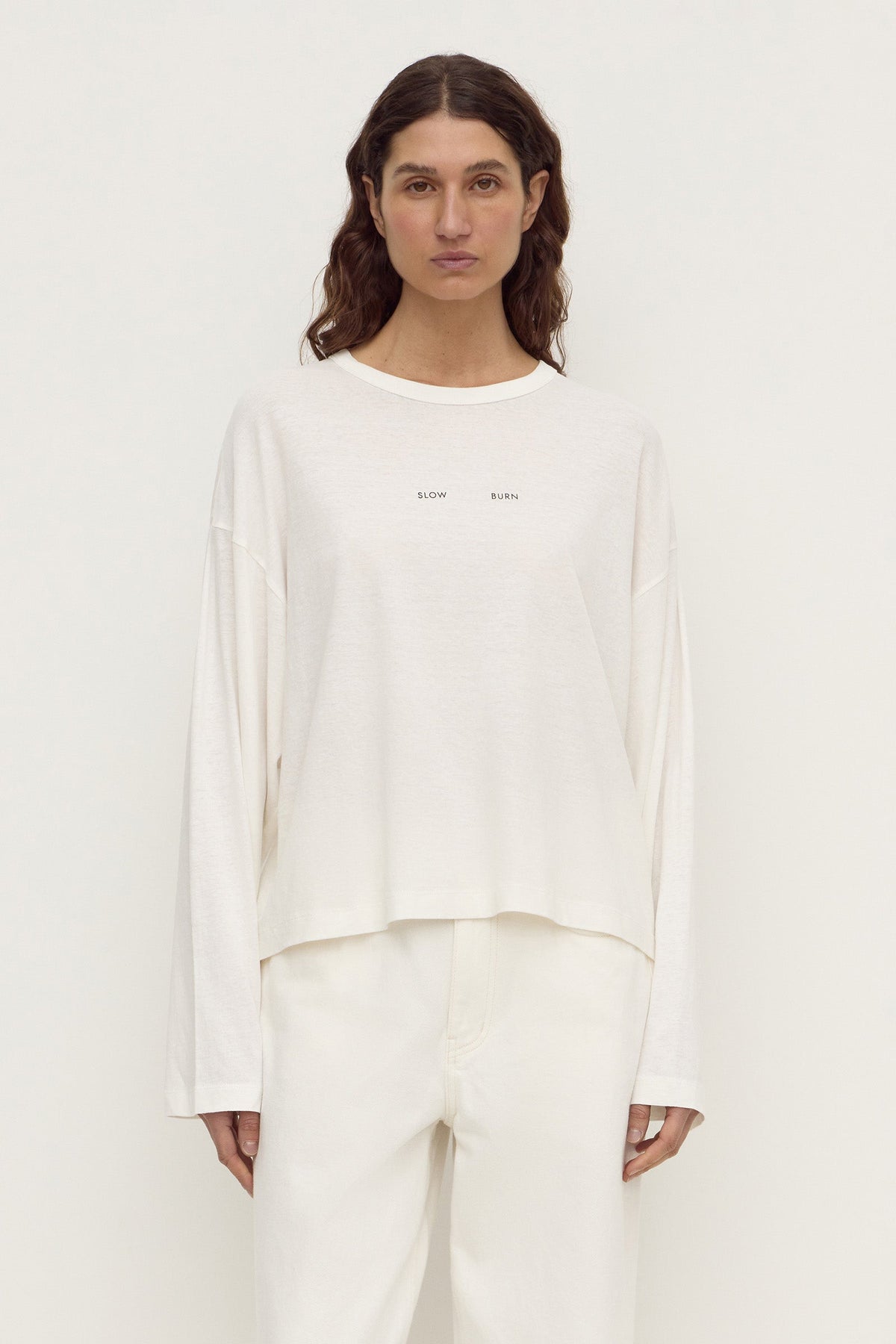 Assembly Label Slow Burn Wide Sleeve Tee in Antique White, front view on model.
