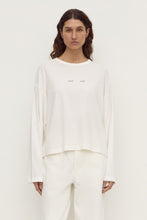 Assembly Label Slow Burn Wide Sleeve Tee in Antique White, front view on model.
