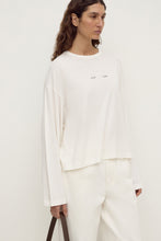 Assembly Label Slow Burn Wide Sleeve Tee in Antique White, back view on model.