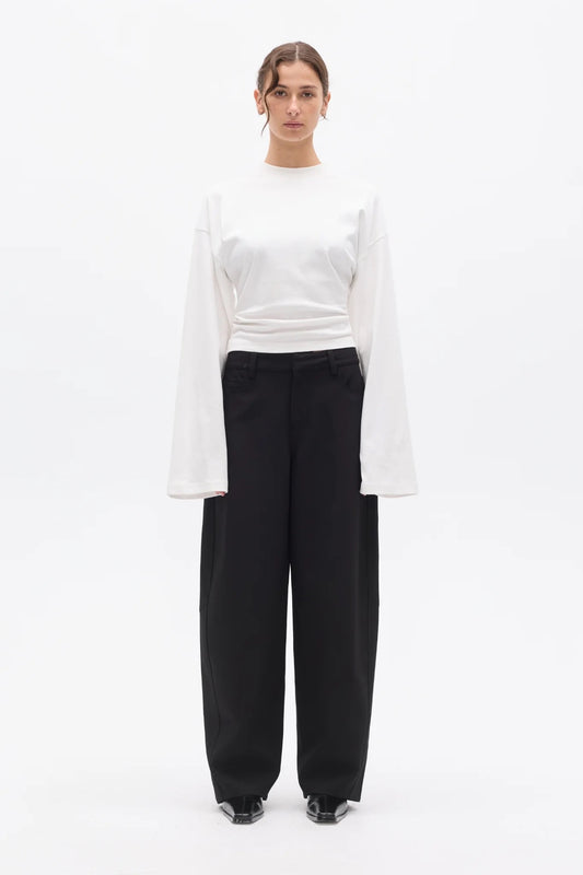 Bayse Brand Lex Long Sleeve in White — a refined update to a classic everyday essential, the Bayse Brand Lex Long Sleeve in White features a relaxed silhouette, dropped shoulders and a slightly cropped length.