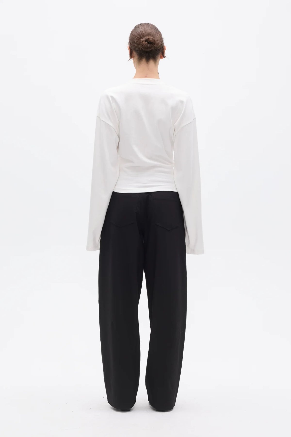 Bayse Brand Lex Long Sleeve in White — a refined update to a classic everyday essential, the Bayse Brand Lex Long Sleeve in White features a relaxed silhouette, dropped shoulders and a slightly cropped length.