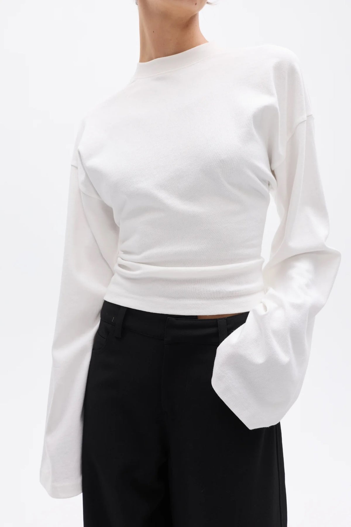 Bayse Brand Lex Long Sleeve in White — a refined update to a classic everyday essential, the Bayse Brand Lex Long Sleeve in White features a relaxed silhouette, dropped shoulders and a slightly cropped length.
