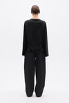 Bayse Brand Priya Long Sleeve Top in Black — a versatile everyday layer with a relaxed, modern silhouette, the Bayse Brand Priya Long Sleeve Top in Black features dropped shoulders and elongated sleeves for an effortlessly refined look.