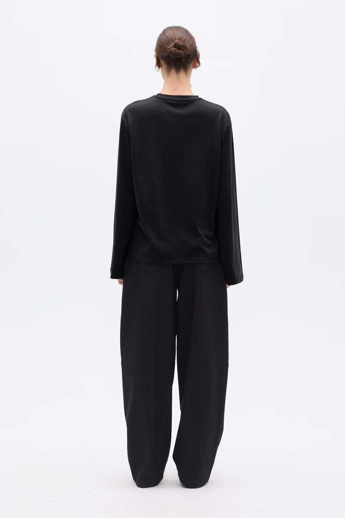 Bayse Brand Priya Long Sleeve Top in Black — a versatile everyday layer with a relaxed, modern silhouette, the Bayse Brand Priya Long Sleeve Top in Black features dropped shoulders and elongated sleeves for an effortlessly refined look.