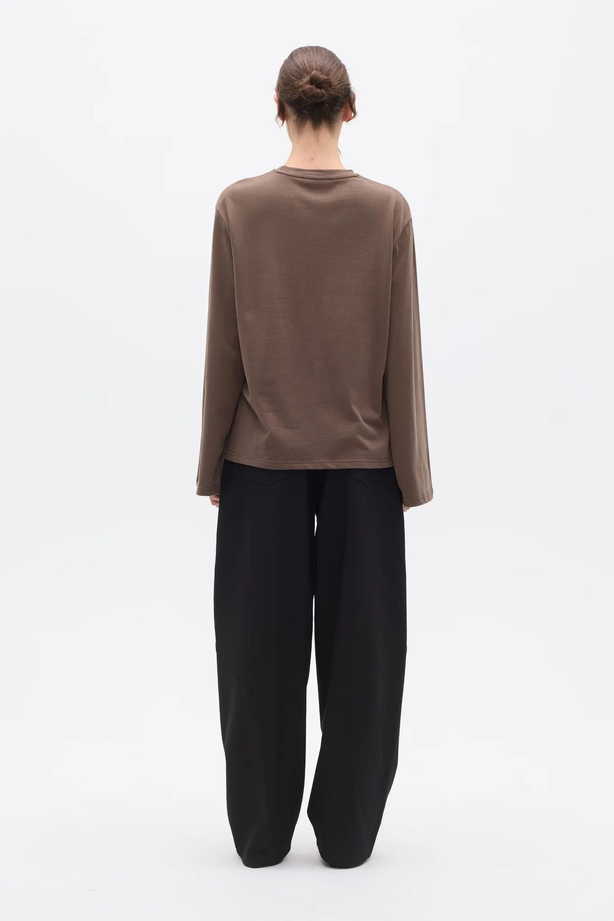 Bayse Brand Priya Long Sleeve Top in Brown — a refined everyday essential with an effortless, modern shape, the Bayse Brand Priya Long Sleeve in Brown features a relaxed fit, dropped shoulders and elongated sleeves.
