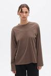 Bayse Brand Priya Long Sleeve Top in Brown — a refined everyday essential with an effortless, modern shape, the Bayse Brand Priya Long Sleeve in Brown features a relaxed fit, dropped shoulders and elongated sleeves.