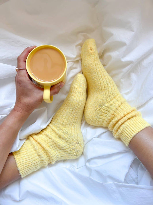 Bed & Butter The Comfiest Socks in Yellow — 7x Sold-Out Collection Made from a blend of responsibly sourced cashmere wool and recycled fibres, these socks will keep your feet cosy and comfy.