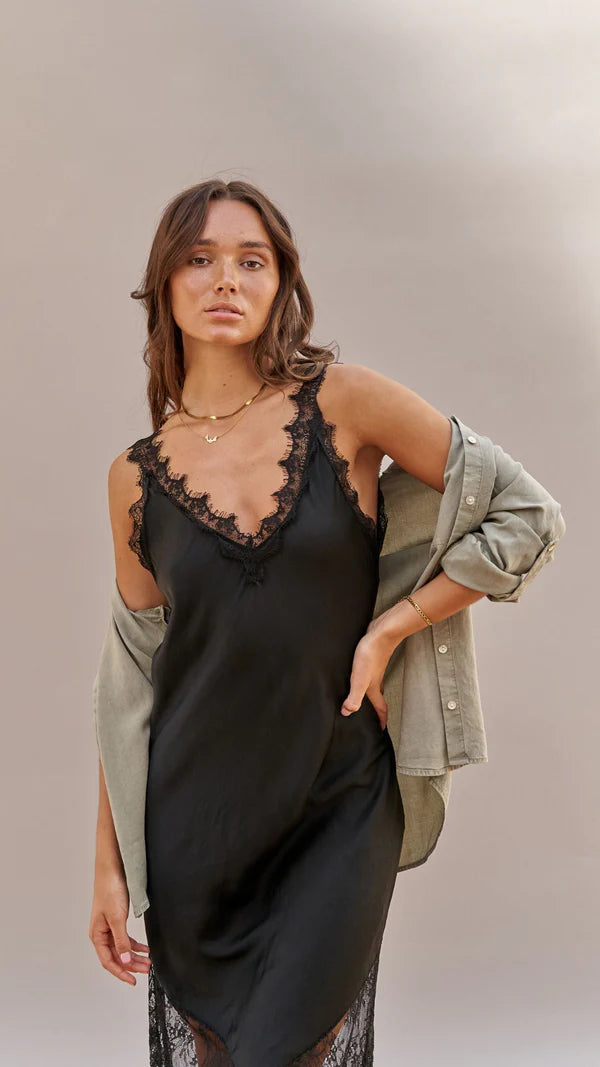 Charli London Solange Slip Dress in Black — the Charli London Solange Slip Dress in Black is the ultimate wardrobe icon, balancing effortless ease with high-end refinement.