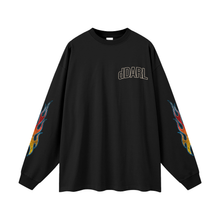 Front product view of the oversized black long sleeve tee showing the small outlined chest logo, dropped shoulders and colourful flame graphics on both sleeves.