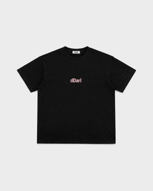 dDARL Puff Tee in Black, front flat lay with pink puff logo
